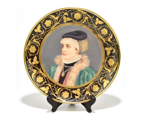 VIENNA; a late 19th century hand painted porcelain wall plaque decorated with a side view portrait of girl wearing a cap with