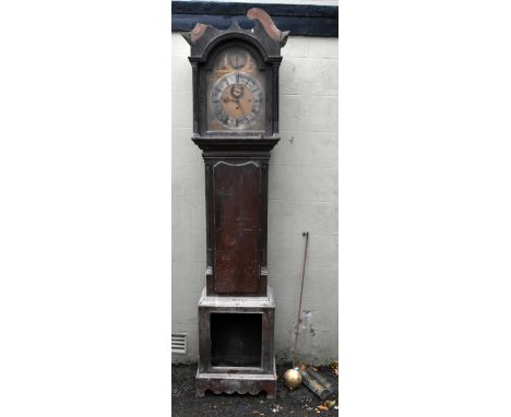 MAPLE & Co OF LONDON; a mahogany longcase clock with arched brass dial, three train movement striking on a coil, and with Rom