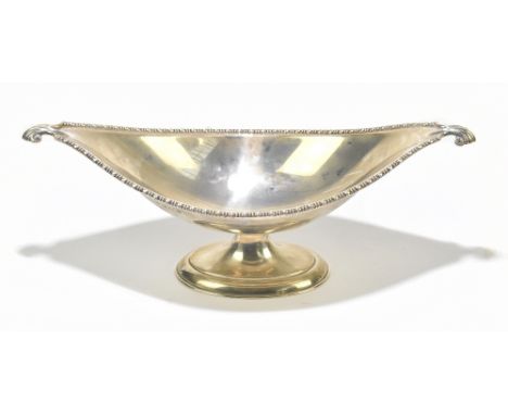ADIE BROS; a George V hallmarked silver shaped oval footed bowl, with twin scrolled handles, Birmingham 1913, length 38.5cm, 