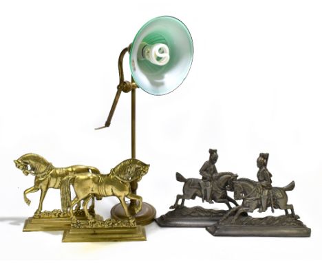 A pair of Victorian style cast metal doorstops, depicting soldiers on horseback, height 24cm, together with a pair of brass d