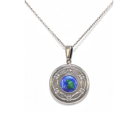 CHARLES HORNER; a George V hallmarked silver and blue/green enamel decorated pendant with circular main plaque centred with t