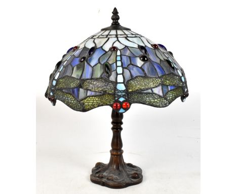 A Tiffany style lamp, with stained glass dragonfly shade, decorated with coloured cabochons, height 36cm.Additional Informati