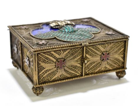 A Continental silver gilt casket in the Arts and Crafts manner, the hinged cover with quatroform panel decorated with a galle