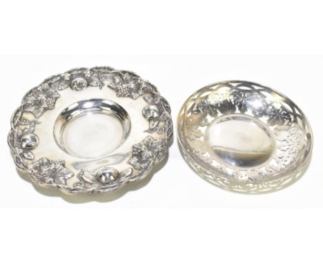 A Portuguese 800 standard silver embossed circular dish decorated with fruit and vine leaves and apples, diameter 27cm, also 