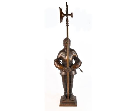 A cast iron novelty companion set modelled as a suit of armour with detachable poker in the form of an axe, height 96cm.Addit