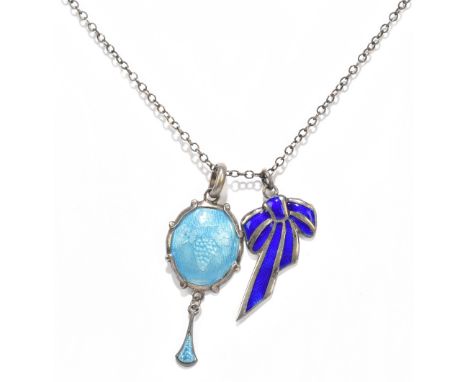 CHARLES HORNER; a sterling silver and pale blue enamel decorated pendant with grape and vine embossed motif beneath the ename