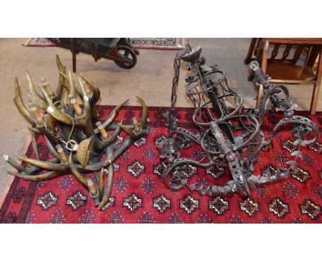 A faux antler light fitting, height approx. 80cm, and a metal scrolling ceiling light (2).Provenance: from a large Berkshire 