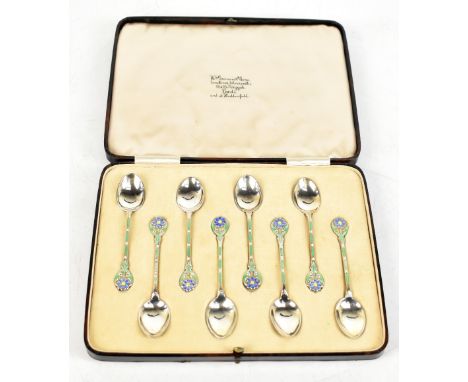 TURNER &amp; SIMPSON; a cased set of six George V hallmarked silver and enamel tea spoons, the handles with flowers above gre