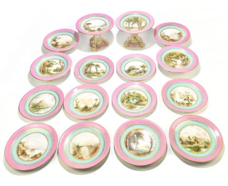 A 19th century sixteen piece part dessert service, each centrally painted with landscape scenes, inside a jewelled decoration