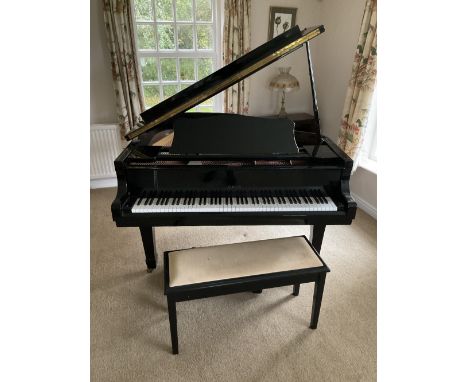 OPUS; a black baby grand piano with overstrung metal frame, on tapered square legs, height 99cm, length 155cm.

Footnote: Ple
