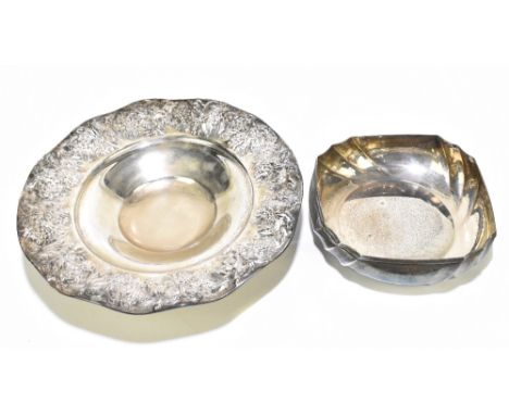 A Continental 800 standard silver dish, embossed with fruiting vines, diameter 31cm, together with a further 800 standard sil