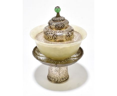 An unusual Eastern white metal and jade bowl stand and cover, the dragon decorated detailed cover with ball finial above a pa