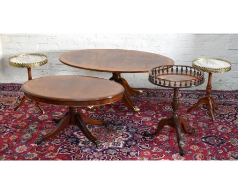 A pair of French style reproduction tripod tables with brass galleries and marble tops, with applied brass mounts to legs, he