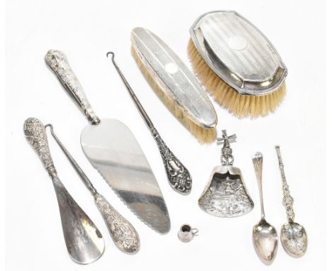 BARKER BROTHERS; a hallmarked silver anointing spoon, Birmingham 1936, together with a Dutch embossed white metal caddy spoon