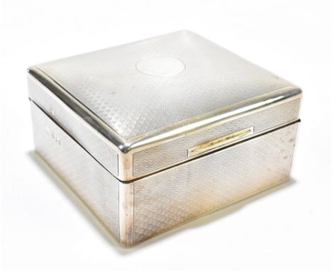 ROBERT PRINGLE &amp; SONS; a George V hallmarked silver cigarette case with engine turned decoration surrounding a vacant cir