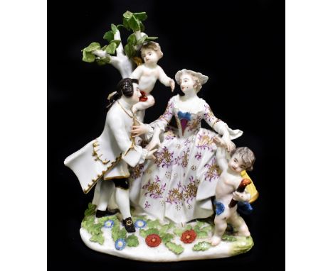 MEISSEN; an 18th century figure group of a young couple with two cupid by their side, apparently unmarked, height 19cm.Additi