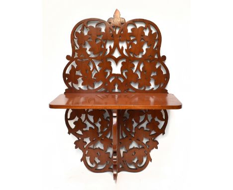 A Victorian pierced mahogany hall shelf, decorated with vine leaves, height 80cm, width 57cm, depth 28cm.Additional Informati