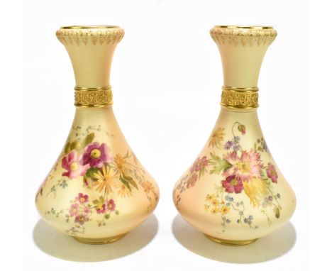 ROYAL WORCESTER; a matched large pair of blush ivory baluster shaped vases with moulded top rim and collar, above floral deco