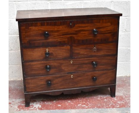 An early 19th century mahogany secrétaire chest, the top drawer with pull-down front enclosing fitted compartments and door, 