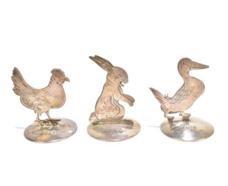 SAMPSON MORDAN &amp; CO; three George V hallmarked menu card holders in the form of animals, including a hare and hen, Cheste