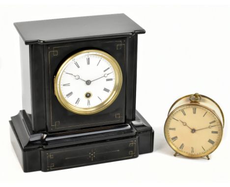 A Victorian black slate mantel clock, the circular enamelled dial set with Roman numerals, height 22cm, together with a 19th 