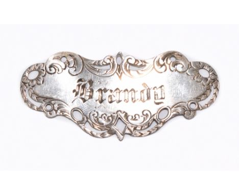NATHANIEL MILLS; a Victorian hallmarked silver decanter label with pierced and chased decoration to the edge, inscribed 'Bran