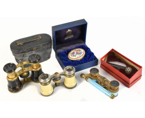Three pairs of opera glasses comprising a blue enamel example, a simulated ivory example and a simulated tortoiseshell exampl
