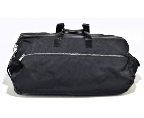STRENESSE GABRIELE STREHLE; a large black fabric and black leather trim holdall, with attached luggage telescopic rod handles