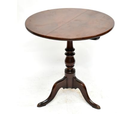 A George III mahogany circular occasional table with tilt top on a turned column and tripod base, height 71cm, diameter 69.5c