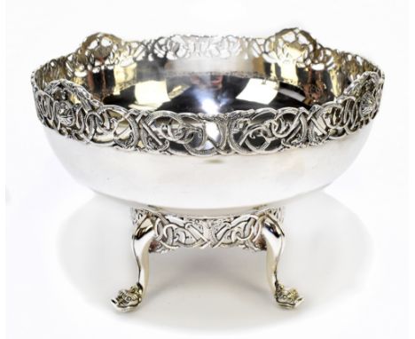 WAKELY &amp; WHEELER; a George V hallmarked silver bowl on stand with pierced rim decorated with mythical beasts and Celtic k