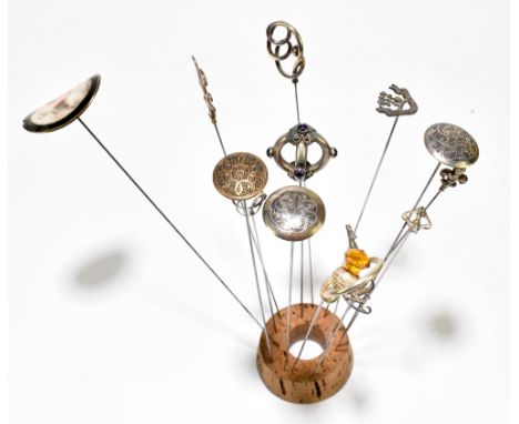 CHARLES HORNER; a group of fourteen hat pins including silver examples.Additional InformationThe oval enamelled portrait hat 