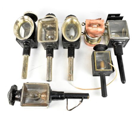 Six Victorian black painted carriage lamps, also a copper ship's lamp (7).Additional InformationA number of the examples have