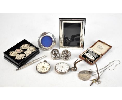 A collection of Victorian and later silver items to include an 1895 silver crown in pendant mount, a hallmarked silver key wi