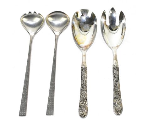A pair of Continental white metal salad servers, the handles modelled with fruiting vines, together with a pair of Mastad pew