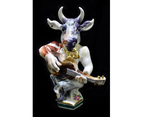 MEISSEN; a 20th century figure of a bull playing the guitar, modelled by Peter Strang, painted marks to base, impressed 20AD,