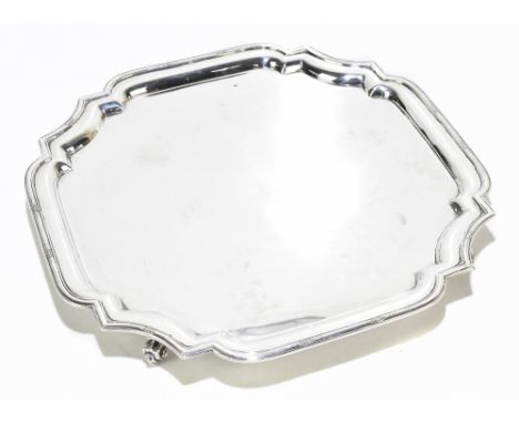C W FLETCHER; a George V hallmarked silver salver of square from, in the Art Deco style with applied stylised detail to the c