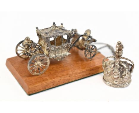 TOYE, KENNING &amp; SPENCER; an Elizabeth II hallmarked silver miniature model of a coronation carriage, raised on a team pli