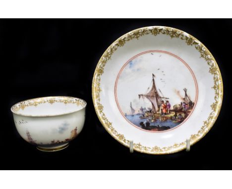 MEISSEN; a 19th century tea bowl and saucer, the tea bowl with interior puce landscape vignette and exterior continuous lands