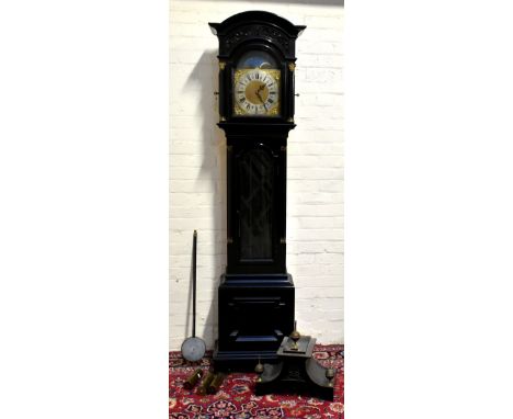 A 19th century Anglo Indian ebonised longcase clock, the moulded hood above arched dial set with rolling moon phase and silve