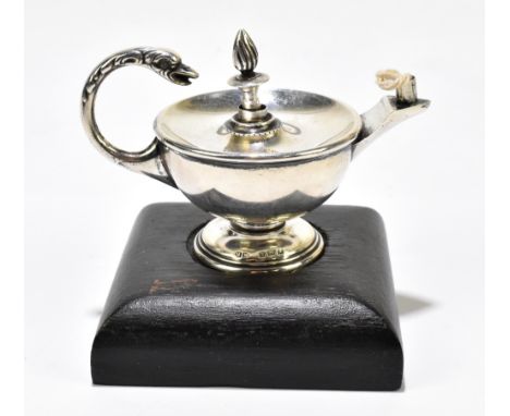 HENRY MATTHEWS; a George V hallmarked silver oil lamp and stopper with serpent handle, Birmingham 1925, raised on wooden asso