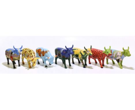 COW PARADE; seven modern ceramic figures of cows each decorated with a different style for a different year.