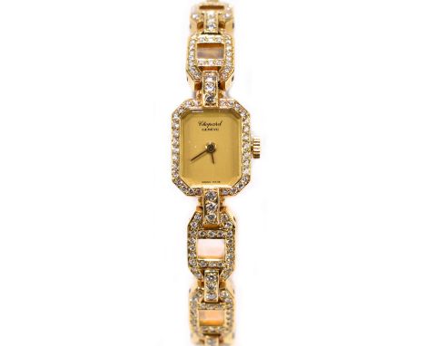 CHOPARD; a lady's 18ct gold and diamond set wristwatch, the octagonal bezel and link bracelet set with modern brilliant cut d