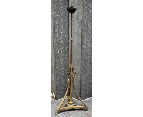 A large late 19th century telescopic brass standard lamp raised on tripartite base.Provenance: from a large Berkshire country
