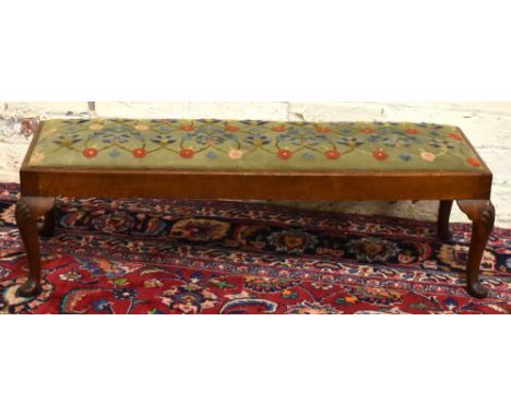 A 1920s walnut Queen Anne style long stool, with shell carved cabriole legs, height 28cm, width 94cm.Additional InformationFr