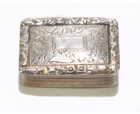 NATHANIEL MILLS; a Victorian hallmarked silver vinaigrette of rectangular form with cast floral edge outside bright cut decor