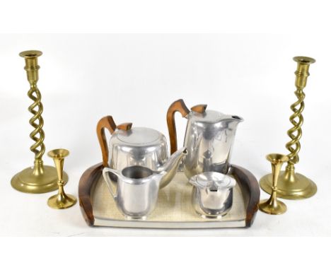 PICQUOT WARE; a five piece tea service, with two pairs of brass candlesticks&nbsp;