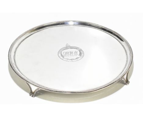 WILLIAM COLLINGS; a George III hallmarked silver salver of circular form with a cast beaded double rim, surrounding a central