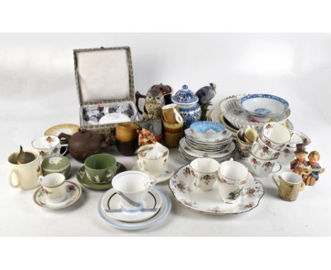 A collection of decorative ceramics and models, to include a Foley bone china part tea service, two Hummel figures, six Joyce