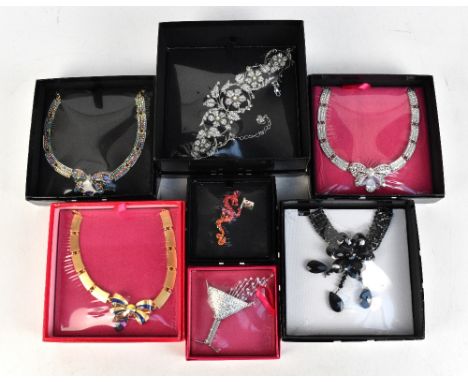 BUTLER &amp; WILSON; an unopened boxed large crystal champagne brooch, 11 x 9cm, a boxed unopened red enamel crystal dragon a