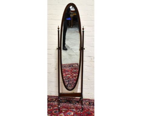 An Edwardian mahogany oval cheval mirror, height 166cm, width 44cm.Additional InformationThe mirror plate with some spotting,